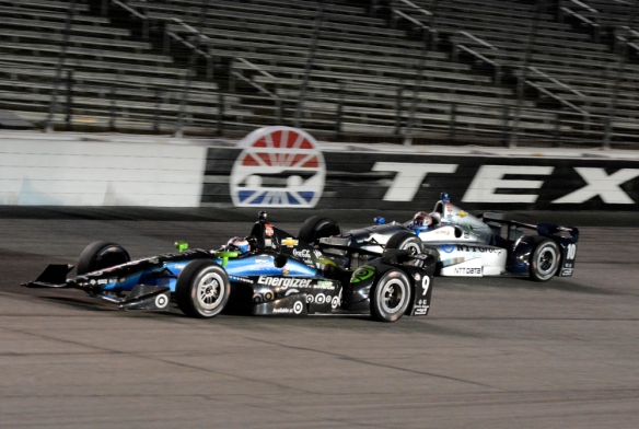 Scott Dixon (9), of New Zealand, leads Tony Kanaan (10), of Brazil, out of Turn 4 late in the Firestone 600 IndyCar auto race at Texas Motor Speedway in Fort Worth, Texas, Saturday June 6, 2015. Dixon won the race and Kanaan finished in second. (AP Photo/Larry Papke) ORG XMIT: TXTG135