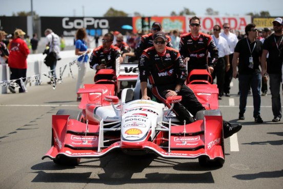 Aug 30, 2015; Sonoma, CA, USA; Pit crew for IndyCar Series driver Juan Pablo Montoya bring the car to the grid before the GoPro Grand Prix of Sonoma at Sonoma Raceway. Mandatory Credit: Kelley L Cox-USA TODAY Sports