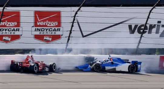 Graham Rahal, left, and Tristan Vautier, of France, hit the wall in Turn 3 after colliding during the Pocono IndyCar 500 auto race Sunday, Aug. 23, 2015, in Long Pond, Pa. (AP Photo/Mel Evans) ORG XMIT: PAME111