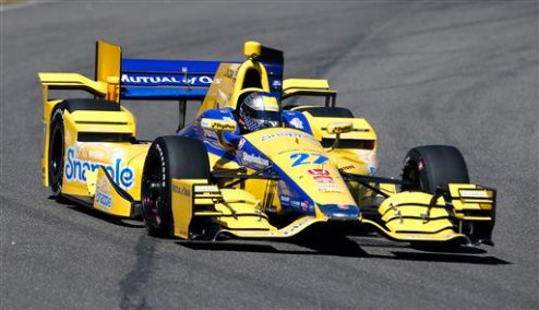 Marco Andretti (27) heads into a turn during IndyCar testing at Barber Motorsports Park, Monday, March 16, 2015, in Birmingham, Ala. Drivers are testing the new aerodynamic packages on their cars. (AP Photo/Butch Dill)